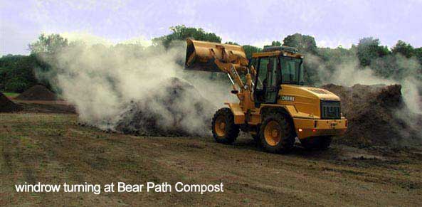 Steamy compost being mixed