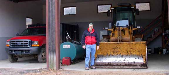 man standing at front of garage